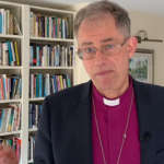 Video still - Bishop Steven in his study looking into camera