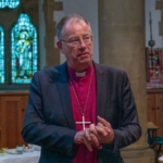 Bishop Steven speaks in a church