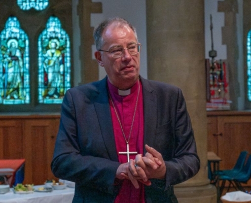 Bishop Steven speaks in a church