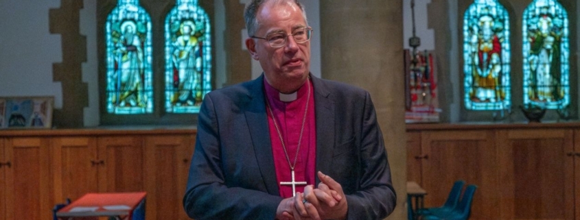 Bishop Steven speaks in a church