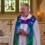 Bishop Steven preaches at a church service