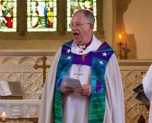 Bishop Steven preaches at a church service