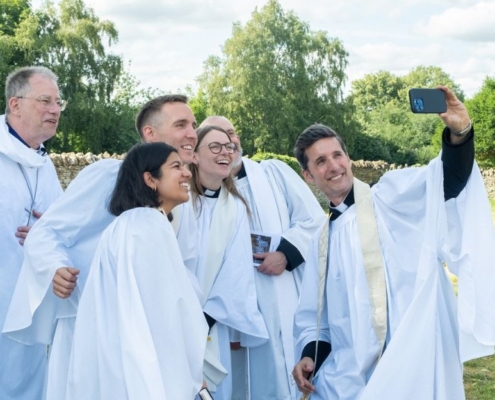 Newly ordained priests take a selfie with Bishop Steven